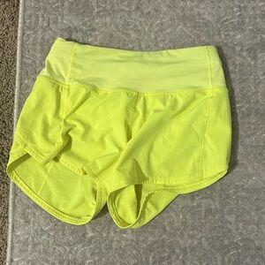 Lululemon Highlighter Yellow 4 inch Size 0 Mid rise Speed ups (Rare)